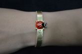 Pulseira dourada joaninha - P1365